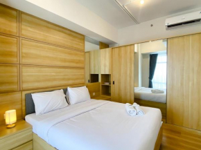 Combined and Nice 2BR at Vasanta Innopark Apartment By Travelio